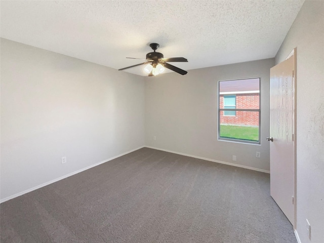 carpeted empty room featuring a textured ceiling and ceiling fan