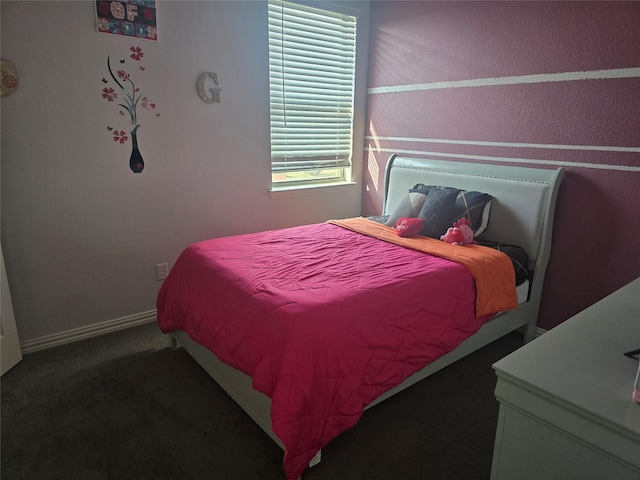 bedroom featuring dark carpet