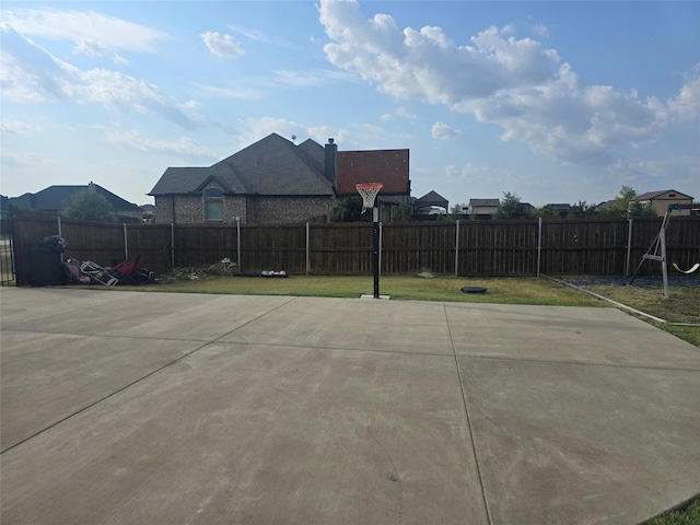 view of patio / terrace featuring basketball hoop and a mountain view