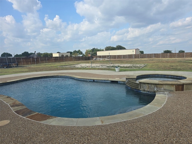 view of swimming pool featuring an in ground hot tub and a lawn