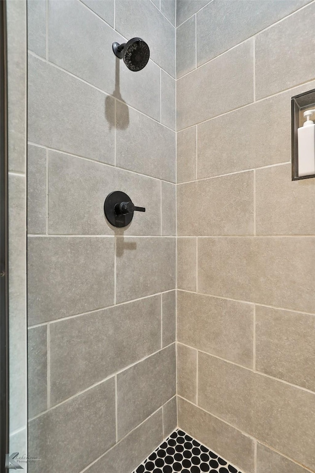 bathroom with tiled shower