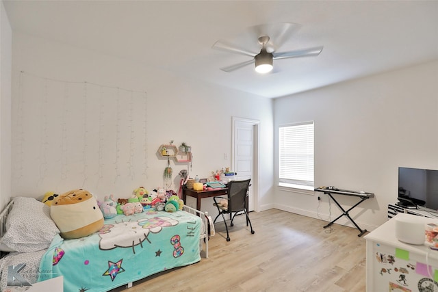 bedroom with light hardwood / wood-style flooring and ceiling fan