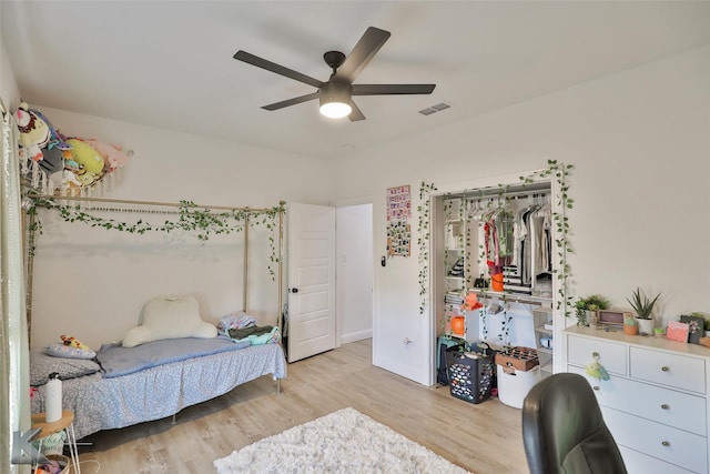 bedroom featuring a closet, ceiling fan, and light hardwood / wood-style flooring