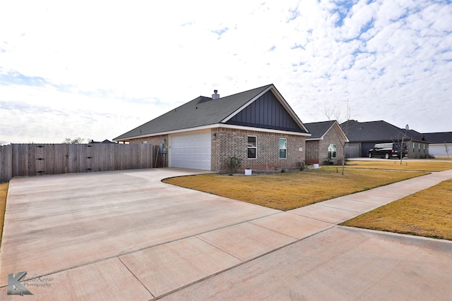 view of home's exterior featuring a yard and a garage