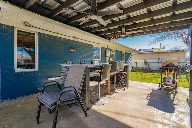 view of patio featuring ceiling fan