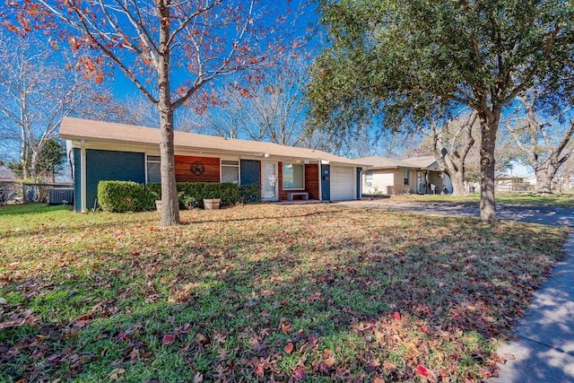 single story home featuring a front yard and a garage