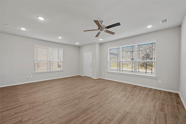 spare room with ceiling fan