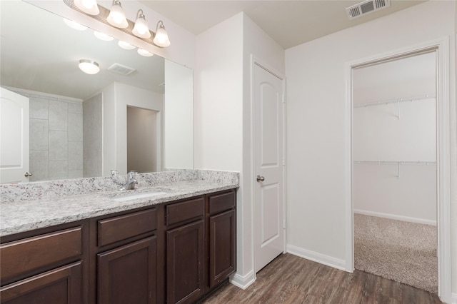 bathroom featuring hardwood / wood-style floors and vanity