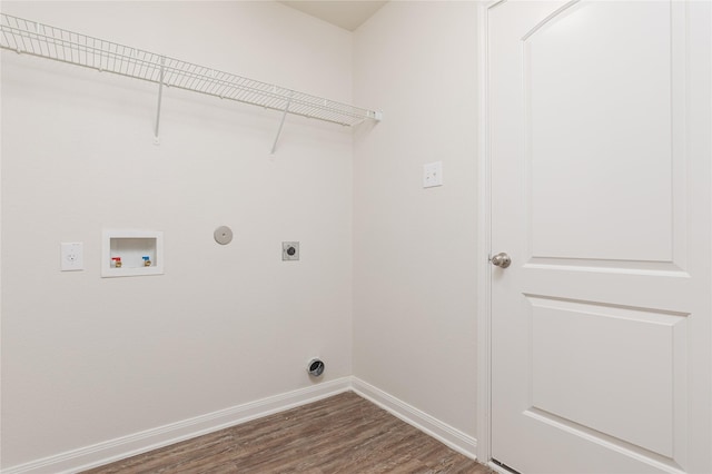 washroom with electric dryer hookup, dark wood-type flooring, gas dryer hookup, and washer hookup