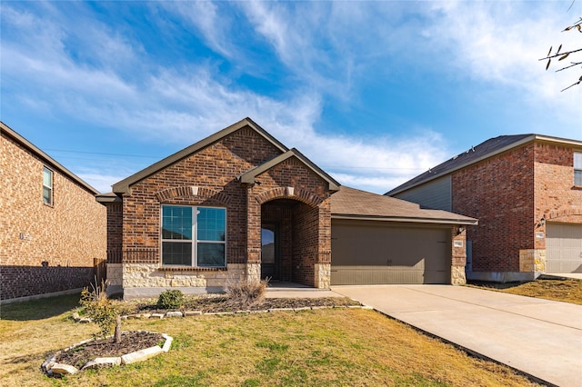 view of front facade with a front yard and a garage