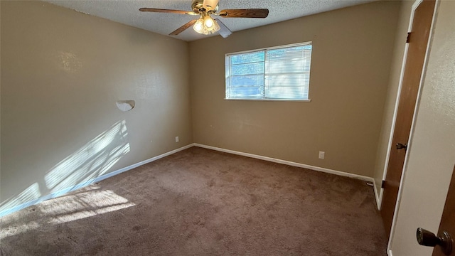 spare room with ceiling fan, carpet floors, and a textured ceiling