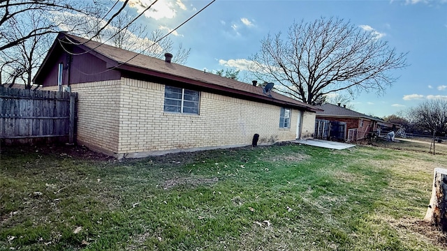 view of home's exterior featuring a yard