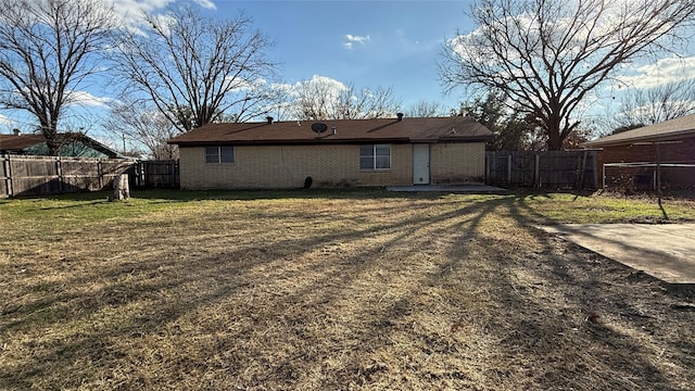 back of house with a yard