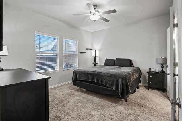 bedroom featuring light carpet and ceiling fan