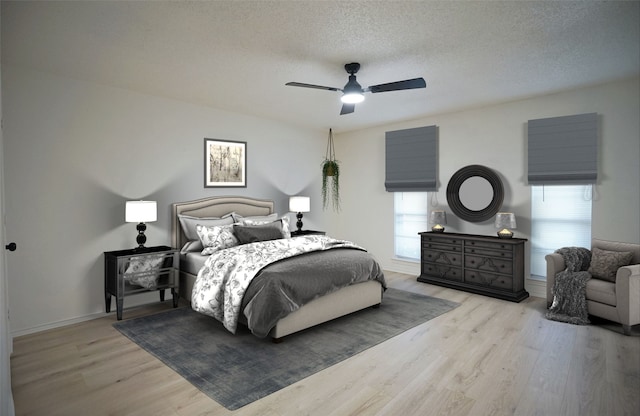 bedroom featuring a textured ceiling, light wood-type flooring, and ceiling fan