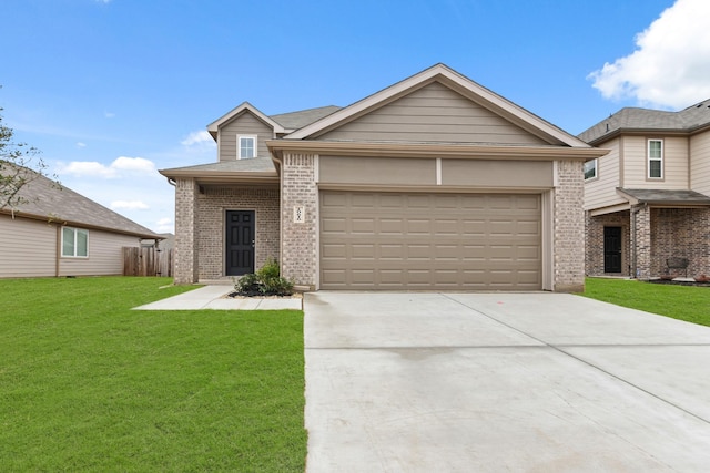 view of front of house with a garage and a front lawn