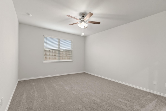 empty room featuring ceiling fan and carpet flooring