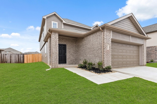 view of front of house with a garage and a front lawn