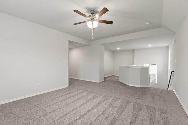 unfurnished room with carpet flooring and ceiling fan