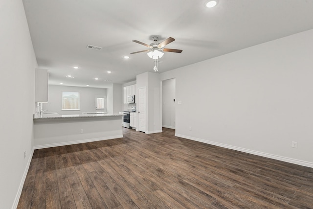 10616 Bleat St, Fort Worth, TX 76036 - unfurnished living room featuring ceiling fan, dark wood-type flooring, recessed lighting, and baseboards