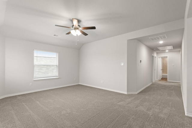 unfurnished room featuring carpet floors, ceiling fan, and vaulted ceiling