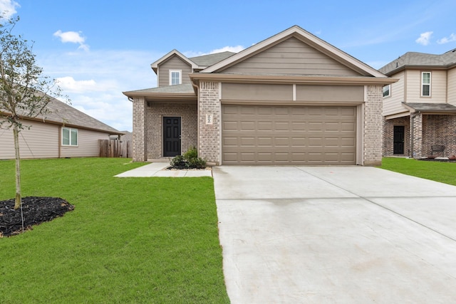 view of front of house featuring a garage and a front yard