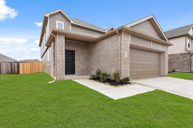 view of front of house with a garage and a front lawn