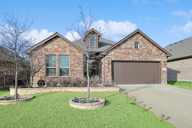 view of front of home with a garage and a front yard