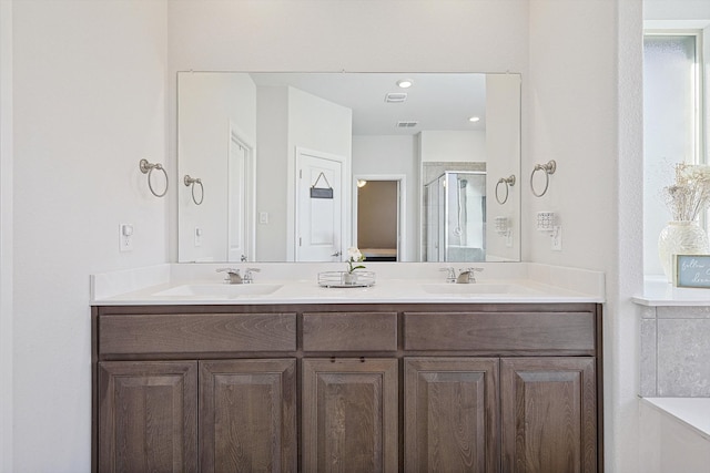 bathroom with vanity and an enclosed shower