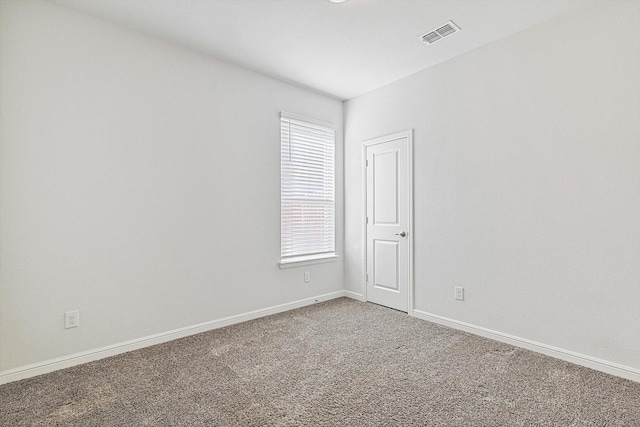 carpeted empty room featuring a healthy amount of sunlight