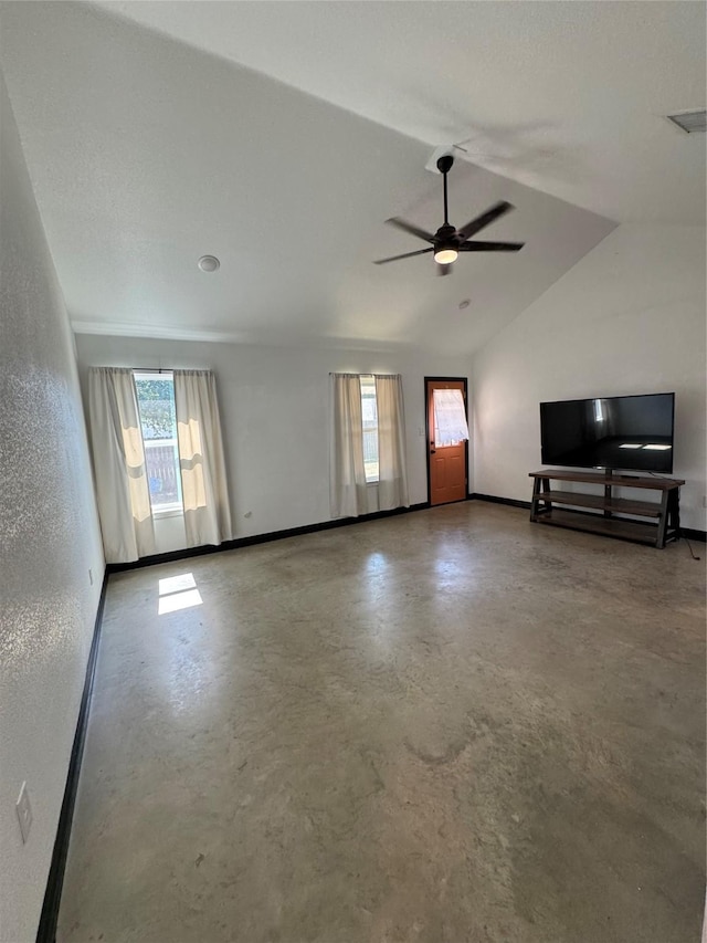 unfurnished living room featuring ceiling fan, lofted ceiling, and concrete floors