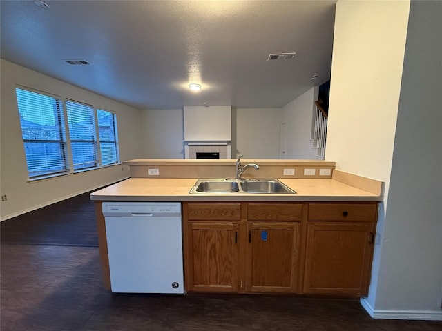 kitchen featuring white dishwasher and sink