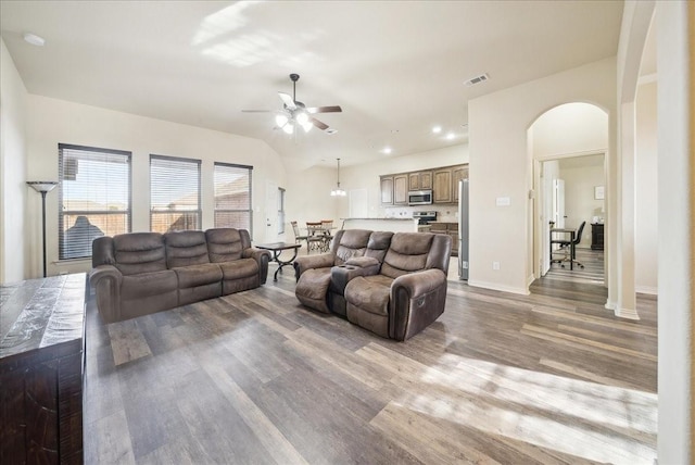 living room with ceiling fan and light hardwood / wood-style floors