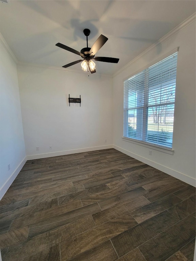 empty room featuring ceiling fan, ornamental molding, and dark wood-type flooring