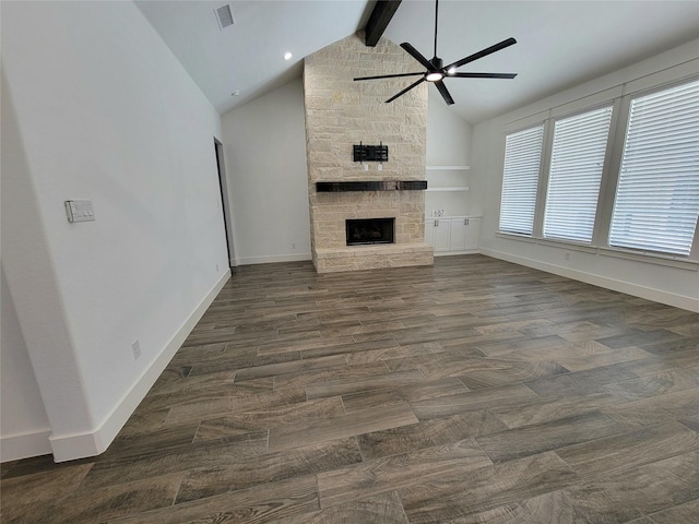 unfurnished living room featuring vaulted ceiling with beams, ceiling fan, dark hardwood / wood-style flooring, and a fireplace