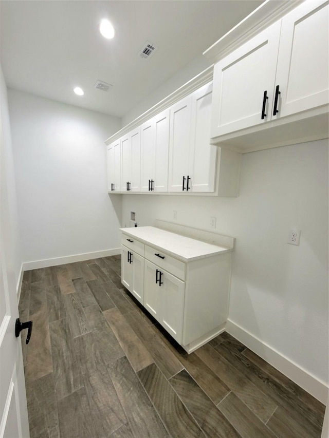 laundry room with hookup for a washing machine and cabinets