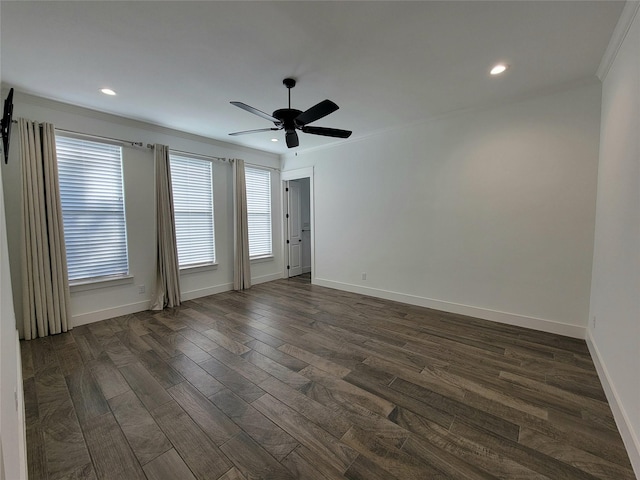 unfurnished room featuring ceiling fan, dark wood-type flooring, and ornamental molding