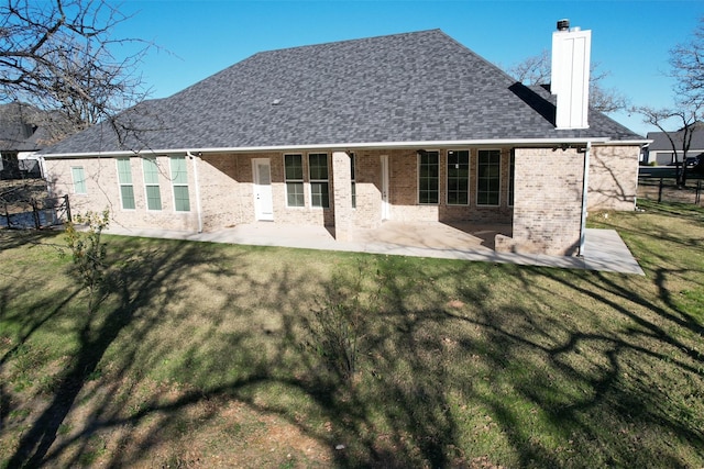 back of house featuring a yard and a patio