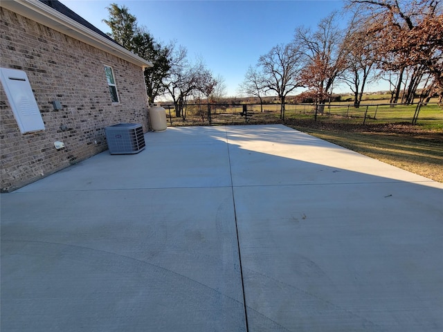 view of patio / terrace featuring central AC and a rural view