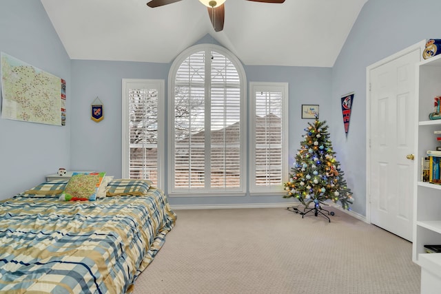 carpeted bedroom featuring ceiling fan and lofted ceiling