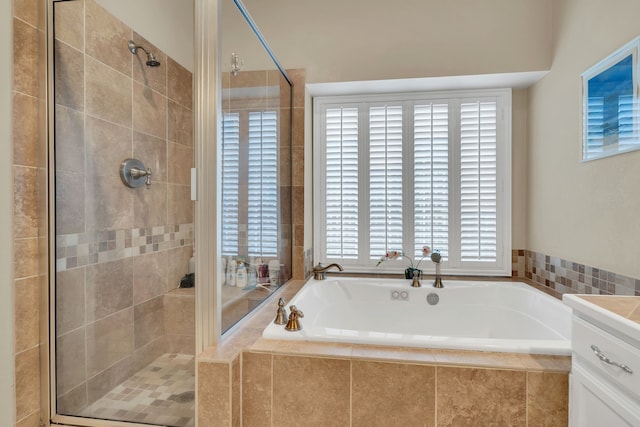 bathroom with separate shower and tub and vanity