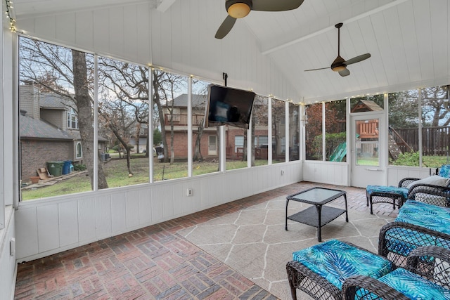 sunroom featuring a wealth of natural light, ceiling fan, and lofted ceiling