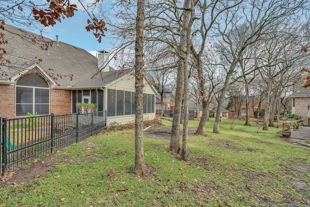 view of yard with a sunroom