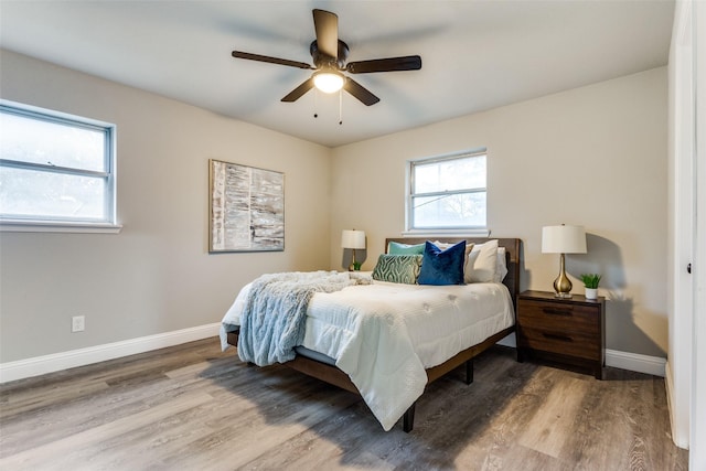 bedroom with wood-type flooring and ceiling fan