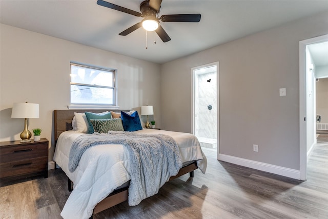 bedroom with ensuite bathroom, hardwood / wood-style floors, and ceiling fan