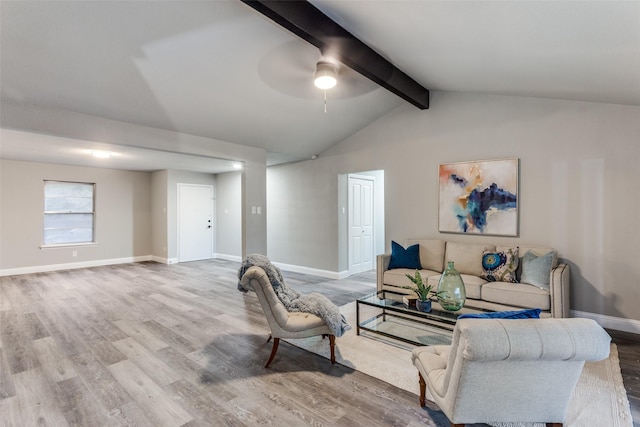 living room featuring hardwood / wood-style floors, ceiling fan, and vaulted ceiling with beams