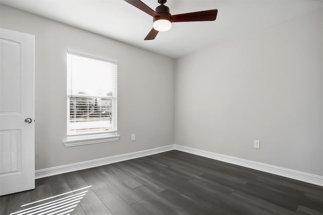 empty room featuring ceiling fan and dark hardwood / wood-style floors