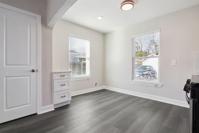 unfurnished bedroom with dark hardwood / wood-style flooring