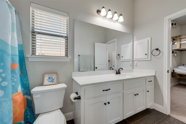 bathroom with vanity and toilet