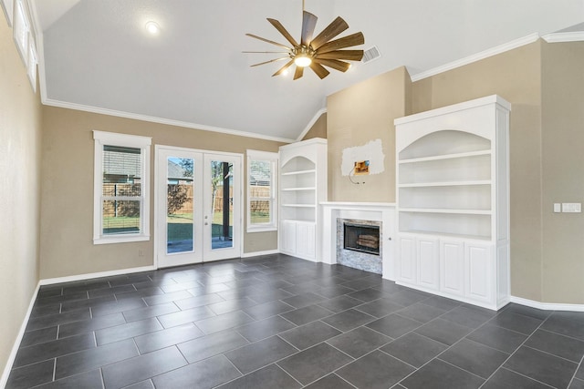 unfurnished living room with built in features, lofted ceiling, ceiling fan, crown molding, and french doors